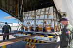 Some of the nearly 5,000 pounds (2,270 kilograms) of Perseverance mission flight hardware, test gear and equipment delivered to Kennedy Space Center on May 11, 2020, is unloaded from a NASA Wallops C-130.