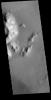 This image from NASA's Mars Odyssey shows part of the central peak and floor of Burton Crater.