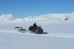 A test model of the RIMFAX instrument, aboard the trailer behind the snow mobile, undergoes field testing in Svalbard, Norway.