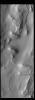 This image from NASA's Mars Odyssey shows Cavi Angusti, located near the south polar cap, consists of large irregular steep-sided depressions termed cavi.