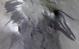 This image acquired on August 2, 2020 by NASA's Mars Reconnaissance Orbiter, shows dozens of dark, dust-free, streaks on slopes surrounding a crater.