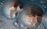 This image acquired on October 1, 2020 by NASA's Mars Reconnaissance Orbiter, shows several craters in Arabia Terra filled with layered rock.