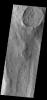 This image from NASA's Mars Odyssey shows an unusual layer of smooth material covering the flanks of the volcano Peneus Patera just south of the Hellas Basin.