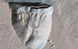 This image acquired on October 11, 2020 by NASA's Mars Reconnaissance Orbiter, shows a pit about 600 meters across that is bounded by a steep scarp on its northern side.