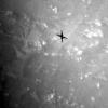 The shadow of NASA's Ingenuity Mars Helicopter can be seen in these images taken by its black-and-white navigation camera during its third flight on April 25, 2021.
