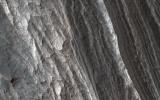 This image acquired on July 11, 2021 by NASA's Mars Reconnaissance Orbiter, shows light-toned layered deposits adjacent to the walls of northwestern Candor Chasma.