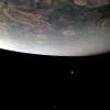 As NASA's Juno spacecraft sped low over the giant planet's cloud tops, on Nov. 29, 2021, its JunoCam instrument captured this look at two of Jupiter's largest moons.