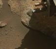 A portion of a cored-rock sample is ejected from the rotary percussive drill on NASA's Perseverance Mars rover. The imagery was collected by the rover's Mastcam-Z instrument on Jan. 15, 2022.