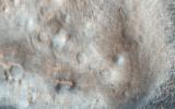 This image acquired on October 24, 2021 by NASA's Mars Reconnaissance Orbiter, shows a flat plain with various low, lumpy mounds, suggesting that they are made up of a different type of material.