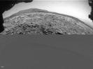 NASA's Curiosity Mars rover used one of its Hazcams to catch this apparent dusty wind gust blowing overhead on March 18, 2022.