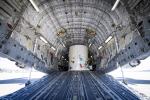 The main body of NASA's Europa Clipper spacecraft is seen in its shipping container, just after arriving aboard a C-17 cargo plane at March Air Reserve Base in Riverside County, California.