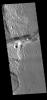 This image from NASA's Mars Odyssey shows Mangala Fossae, a long linear depression called a graben. It was formed by extension of the crust and faulting.