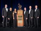 Members of NASA's Ingenuity Mars Helicopter team stand next to the Collier Trophy during the Robert J. Collier Dinner in Washington on June 9, 2022.
