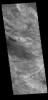 This image from NASA's Mars Odyssey shows part of Ceti Mensa. This mesa feature is located in western Candor Chasma and is composed of layered deposits and sand dunes.