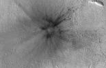 This meteoroid impact crater on Mars was discovered using the black-and-white Context Camera aboard NASA's Mars Reconnaissance Orbiter. The Context Camera took these before-and-after images of the impact in a region of Mars called Amazonis Planitia.