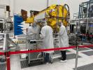 Engineers and technicians work on the science instrument payload for the NASA-ISRO Synthetic Aperture Radar (NISAR) mission in a JPL clean room.