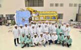 A team of engineers and technicians from ISRO and NASA pose in June at ISRO's U R Rao Satellite Centre in Bengaluru, India, after working together to combine the two main components of the NISAR satellite.