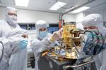 Engineers at NASA's Jet Propulsion Laboratory in April 2023 examine the imaging spectrometer that will ride aboard the first of two satellites to be launched by the Carbon Mapper Coalition.
