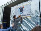 Team members at JPL said farewell to the Roman Coronagraph Instrument on May 17, 2024, by signing their names to a flag on the outside of the shipping container that carried the instrument to NASA's Goddard Space Flight Center.