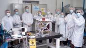 In a clean room at NASA's Jet Propulsion Laboratory in Southern California in March 2024, engineers and technicians pose with the agency's Farside Seismic Suite while the payload is readied for testing.