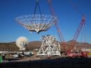 A crane lowers the steel reflector framework for Deep Space Station 23 into position Dec. 18, 2024. Panels will be affixed to the structure create a curved surface to collect radio frequency signals.